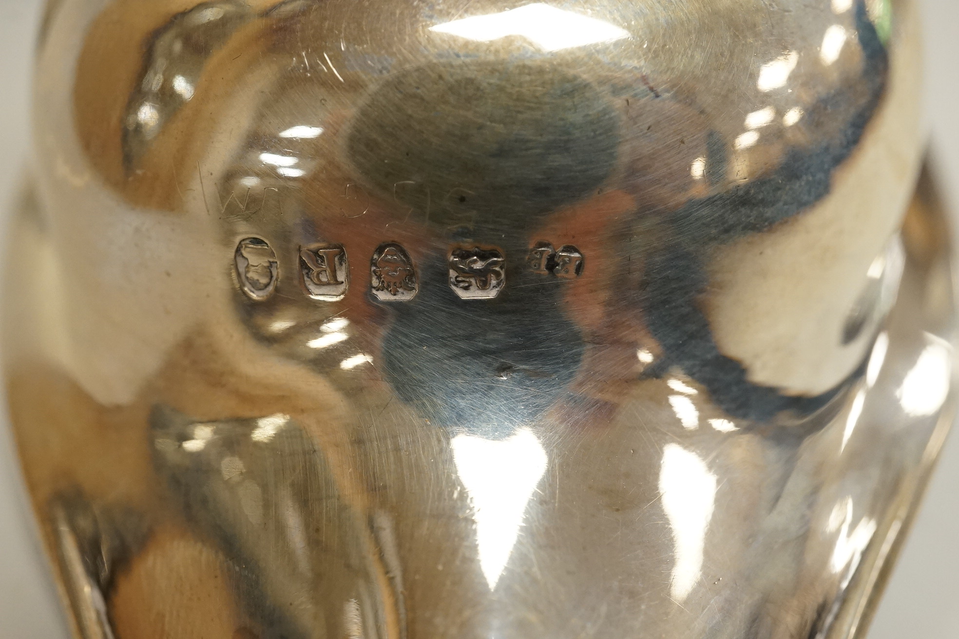 A George III silver pap boat, maker ?? and EB, London 1812, length 12.1 cm, together with a pair of Georgian Scottish silver boat shaped pedestal salts, maker RG, gross weight 7oz.